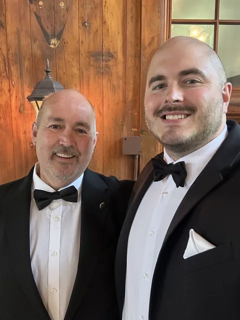 Roger with his son on a wedding day