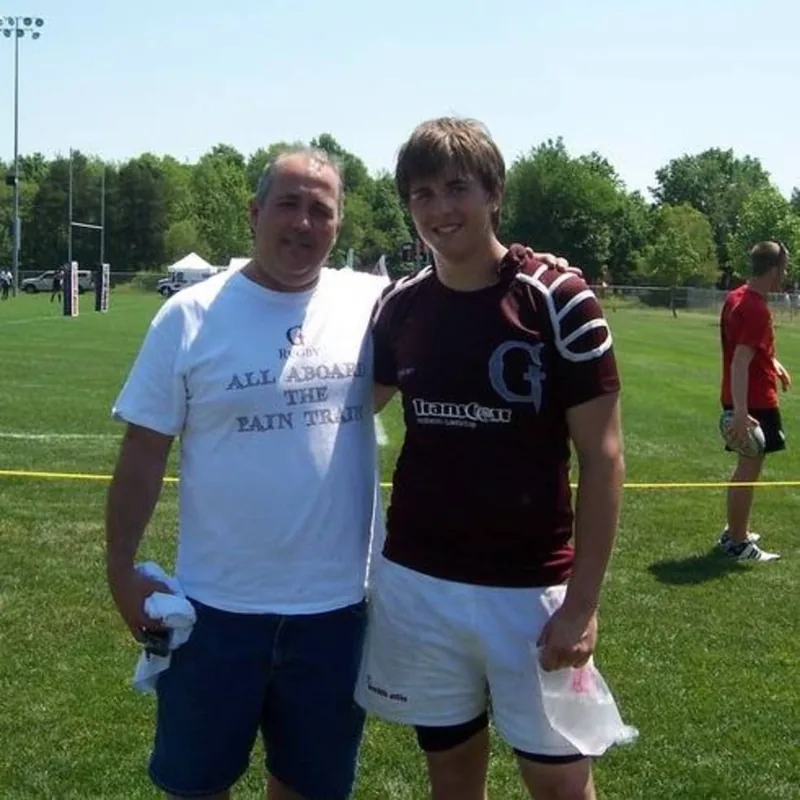 Roger with his son after a Grandville rugby match